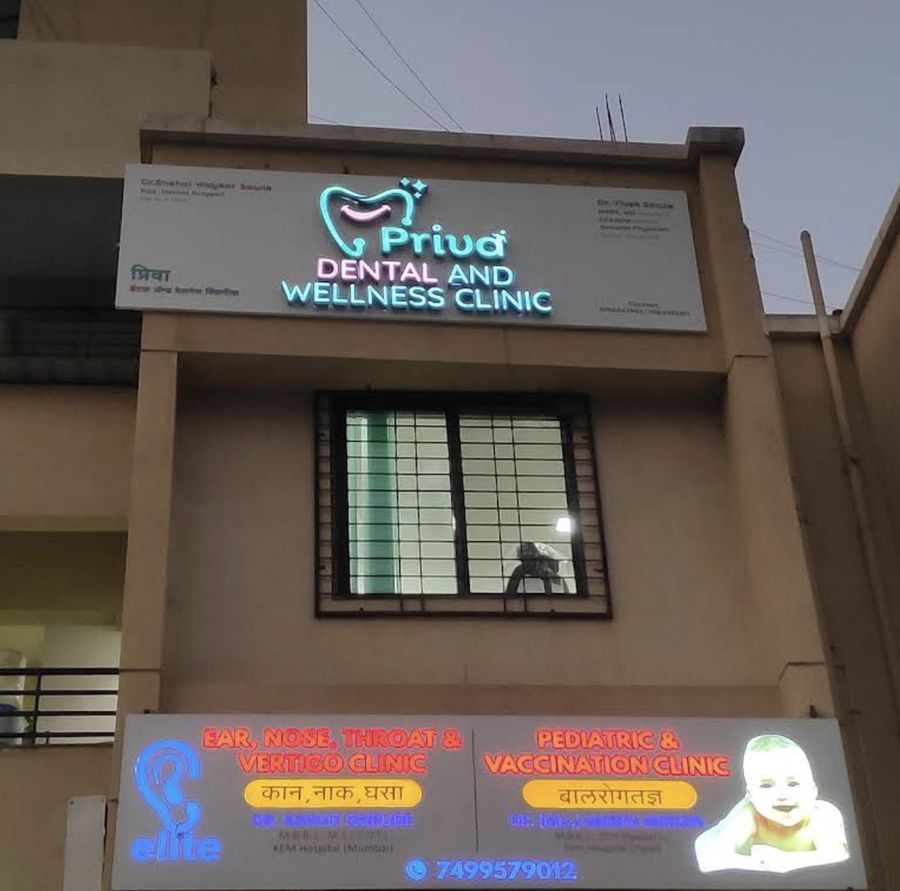 Illuminated Priva Dental and Wellness Clinic signboard on Shivsai Complex, Balewadi, Pune