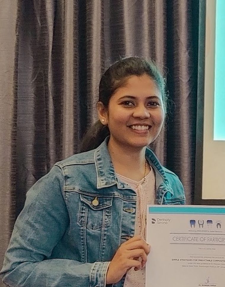 Dr Snehal Waykar Sawle receiving a certificate at a Dentsply Sirona continuing education lecture on composite restorations